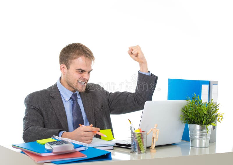 Corporate portrait of young attractive businessman gesturing and celebrating business success excited raising his fist in victory and euphoria concept isolated on white background. Corporate portrait of young attractive businessman gesturing and celebrating business success excited raising his fist in victory and euphoria concept isolated on white background