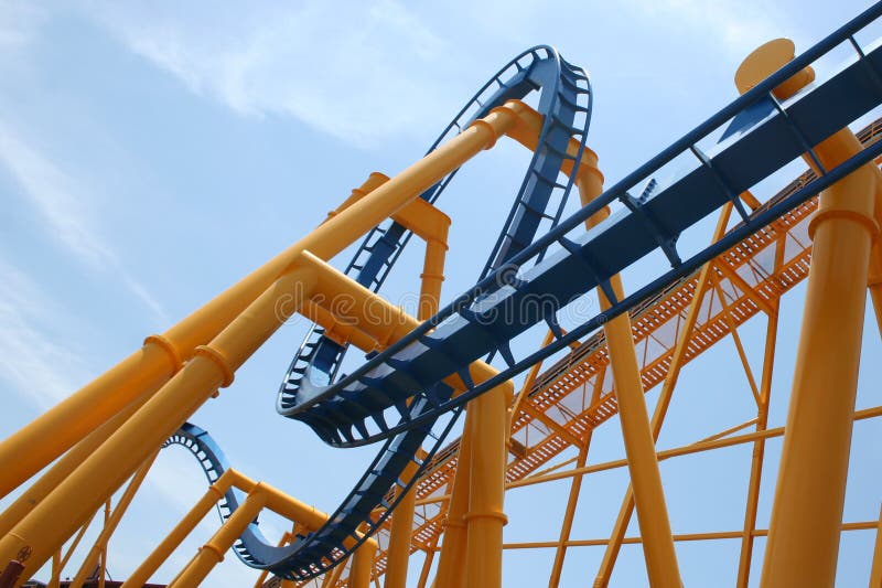 View of a loop on a roller coaster on a bright summer day. View of a loop on a roller coaster on a bright summer day