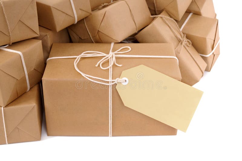 Brown paper package with blank manila label isolated on white stock image Brown paper package with blank manila label isolated on white stock image