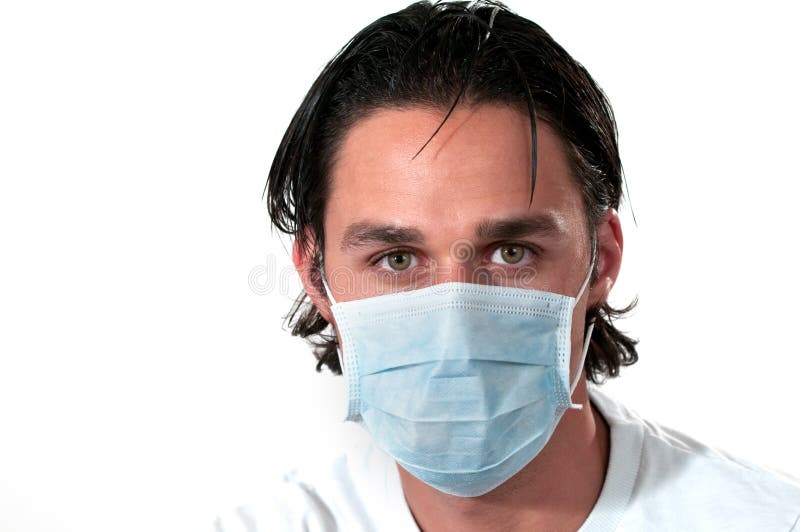 Uomo che porta mascherina medica fotografia stock libera da diritti Uomo che porta mascherina medica fotografia stock libera da diritti