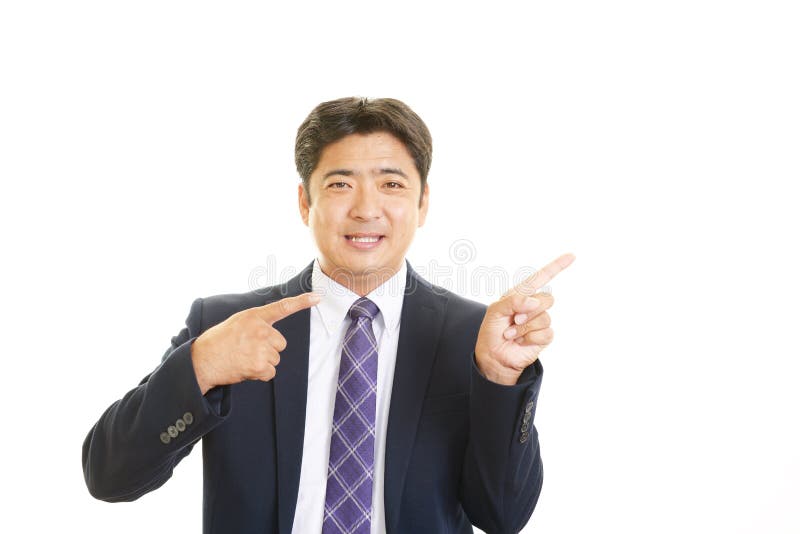 Uomo d'affari asiatico sorridente immagini stock