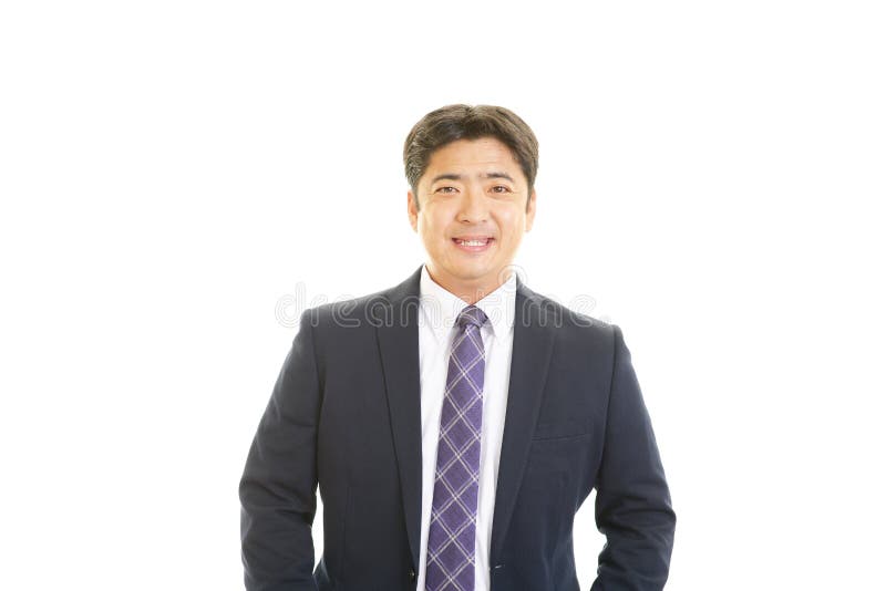 Uomo d'affari asiatico sorridente immagine stock