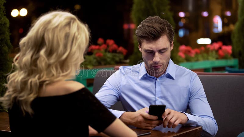 Businessman not paying attention to his girlfriend, addicted to gadget, problem, stock photo. Businessman not paying attention to his girlfriend, addicted to gadget, problem, stock photo