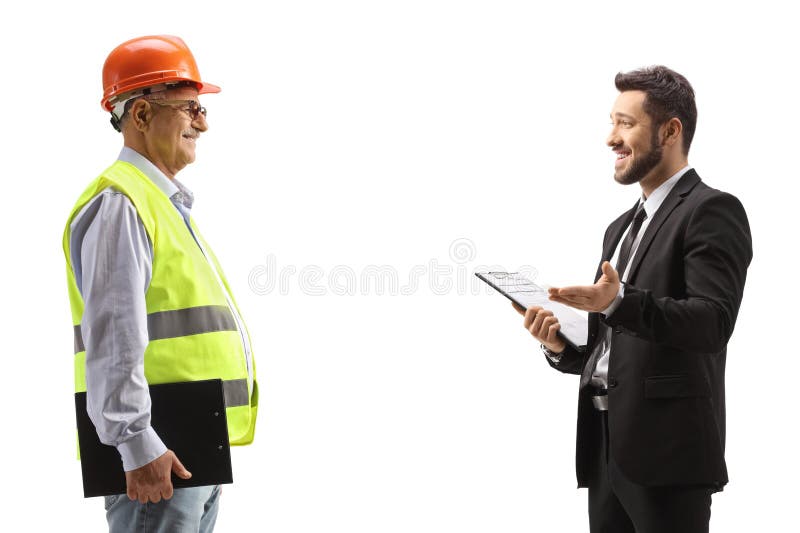 Uomo d'affari che parla con un ingegnere immagine stock