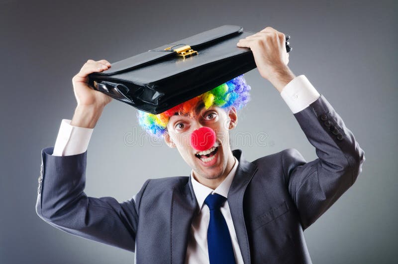 Uomo d'affari del pagliaccio - concetto di affari divertenti fotografia stock Uomo d'affari del pagliaccio - concetto di affari divertenti fotografia stock