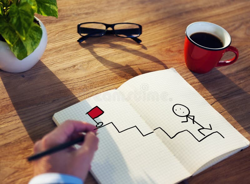 Businessman Drawing Goal Concept on a Note Pad. Businessman Drawing Goal Concept on a Note Pad