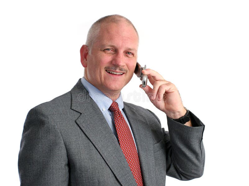 Uomo d'affari felice sul telefono delle cellule fotografie stock Uomo d'affari felice sul telefono delle cellule fotografie stock