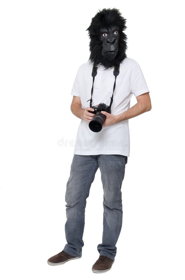 Uomo della gorilla con una macchina fotografica di DSLR immagini stock Uomo della gorilla con una macchina fotografica di DSLR immagini stock