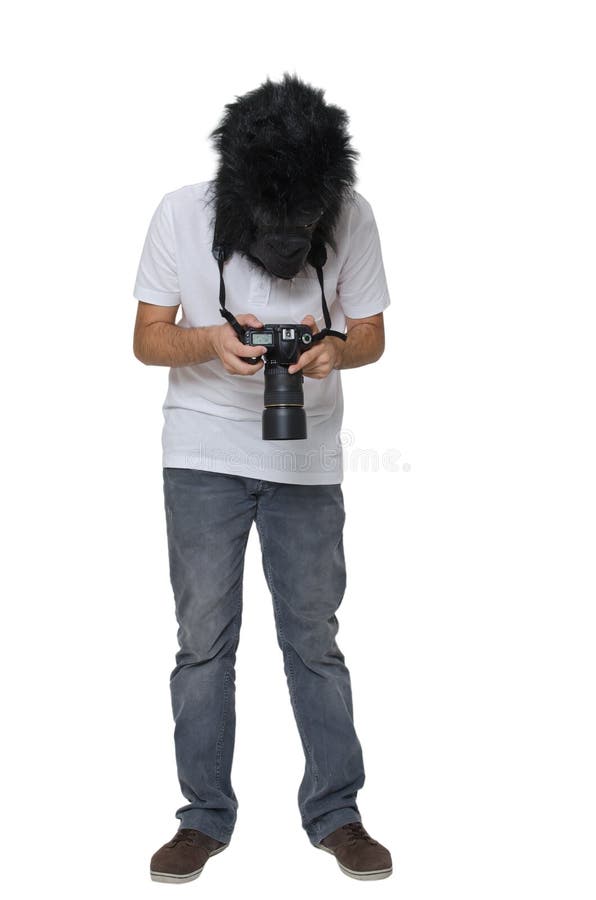 Uomo della gorilla con una macchina fotografica di DSLR fotografie stock Uomo della gorilla con una macchina fotografica di DSLR fotografie stock