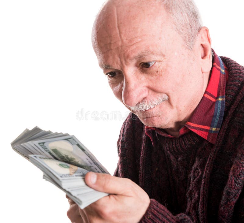Uomo senior che tiene una pila di soldi Ritratto di un uomo d'affari anziano emozionante immagini stock Uomo senior che tiene una pila di soldi Ritratto di un uomo d'affari anziano emozionante immagini stock