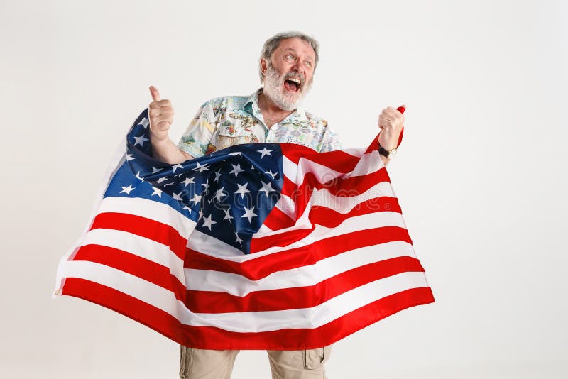 Uomo senior con la bandiera degli Stati Uniti d'America immagini stock Uomo senior con la bandiera degli Stati Uniti d'America immagini stock