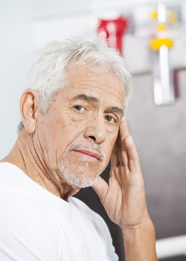 Portrait of sad senior man at rehab center. Portrait of sad senior man at rehab center