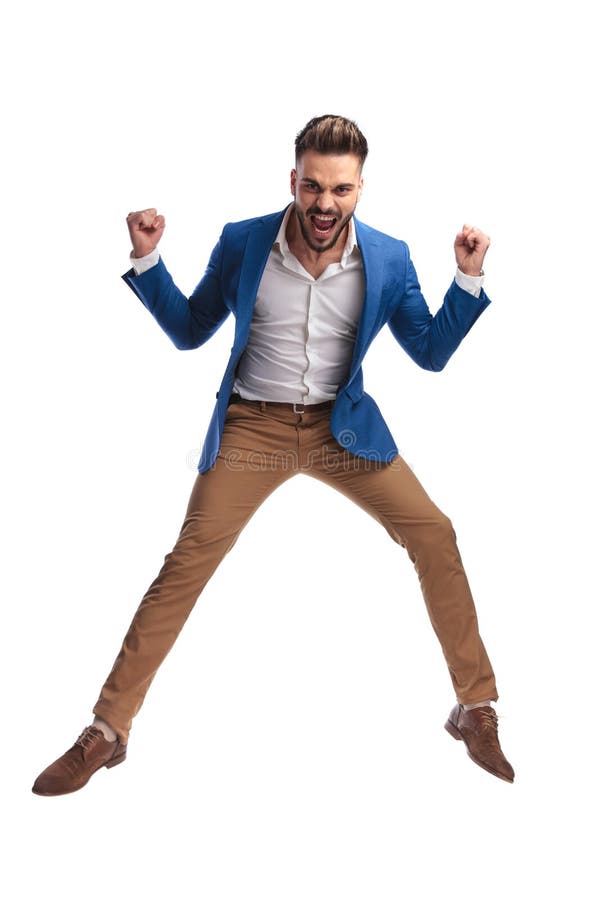 Uomo sexy in vestito che celebra vittoria e gridare fotografia stock libera da diritti Uomo sexy in vestito che celebra vittoria e gridare fotografia stock libera da diritti