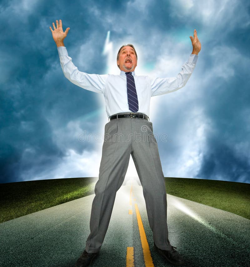 A middle aged business man standing in an asphalt road reacts with shock and surprise as he is hit with a bolt of light or lightening. Arms are held high in the air. A middle aged business man standing in an asphalt road reacts with shock and surprise as he is hit with a bolt of light or lightening. Arms are held high in the air.