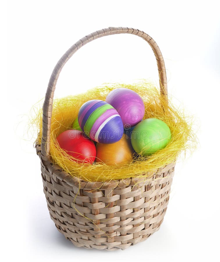 Uova di Pasqua in un canestro fotografie stock Uova di Pasqua in un canestro fotografie stock
