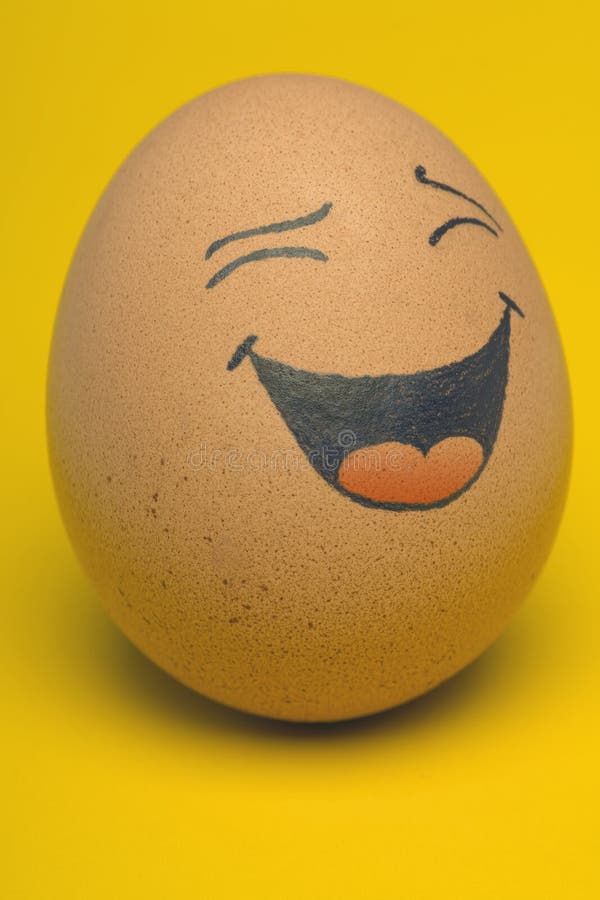 Single, Smiling comical Egg with yellow background. Single, Smiling comical Egg with yellow background.