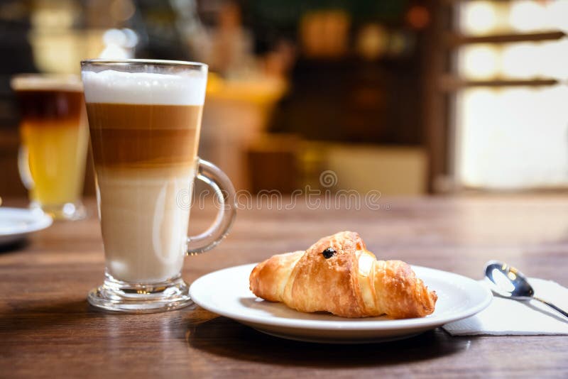 Up of coffee and croissant