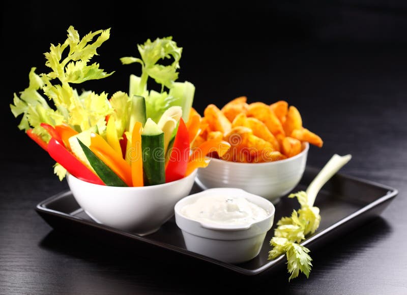 Raw vegetable and wedges with cream cheese dip. Raw vegetable and wedges with cream cheese dip
