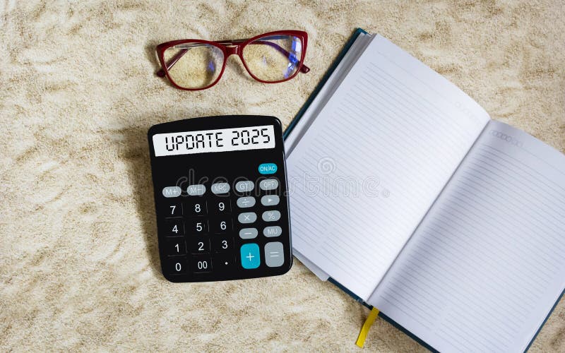 2025 UPDATE text on the calculator display. near the notepad for writing.