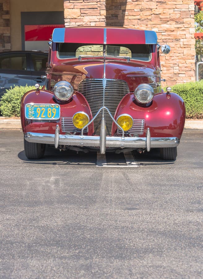 Upland, United States of America - July 29, 2017: 1939 Ruby Maroon Chevrolet appears in spontaneous classic car show in suburban parking lot. Upland, United States of America - July 29, 2017: 1939 Ruby Maroon Chevrolet appears in spontaneous classic car show in suburban parking lot.