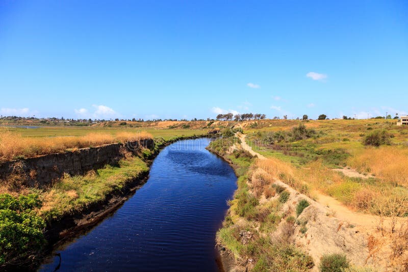 Upper Newport Bay Nature Preserve hiking trail winds along the marsh, where you will see wildlife in Newport Beach, California USA