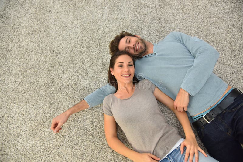 Upper view of couple on the carpet floor stock image