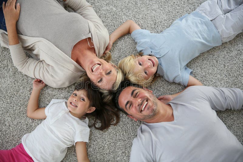 Upper view of family lying on the floor royalty free stock photo