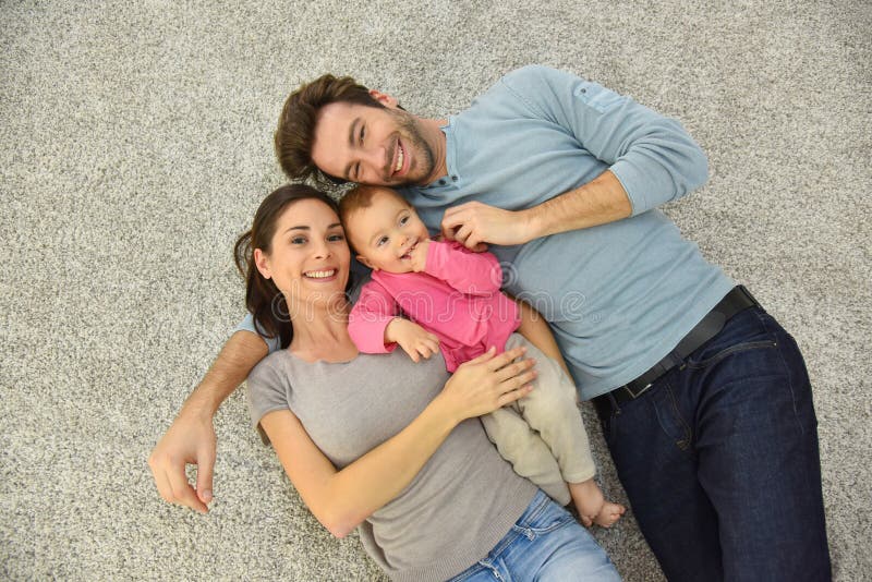 Upper view of happy young family on the floor royalty free stock photo