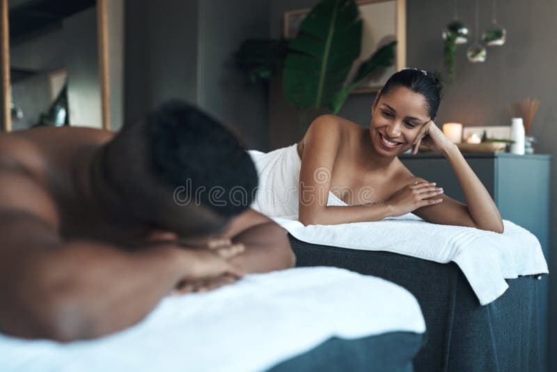 Experience tranquility like royalty. a young couple relaxing on massage beds at a spa. Experience tranquility like royalty. a young couple relaxing on massage beds at a spa