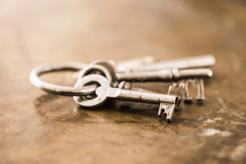 Close-up of a group of antique skeleton keys on wooden background. Close-up of a group of antique skeleton keys on wooden background