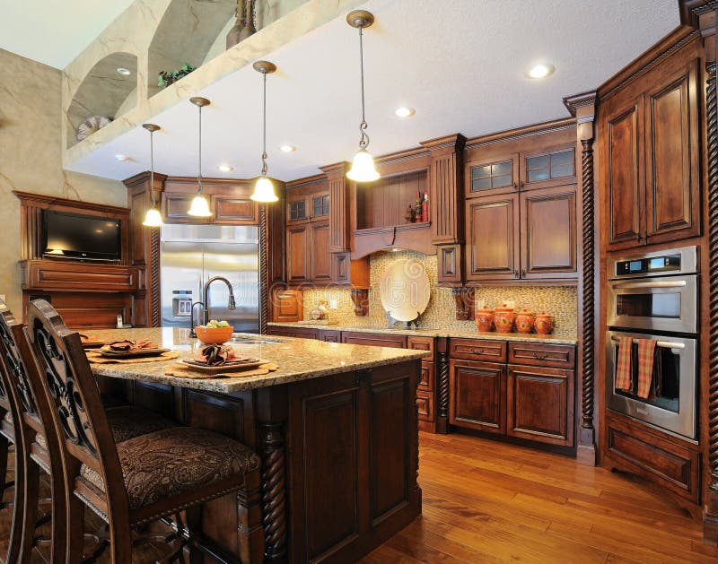 Kitchen Island and Stove Custom Wood Cabinets. New Luxury Home Interior ...
