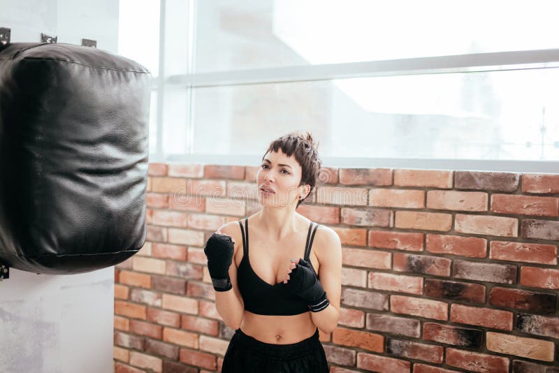 Upset beautiful woman had done mistakes in boxing.Defeated boxer royalty free stock image Upset beautiful woman had done mistakes in boxing.Defeated boxer royalty free stock image