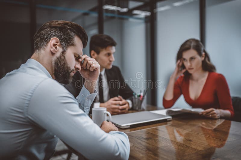 Having a problem. An upset couple trying to solve their problems with a lawyer