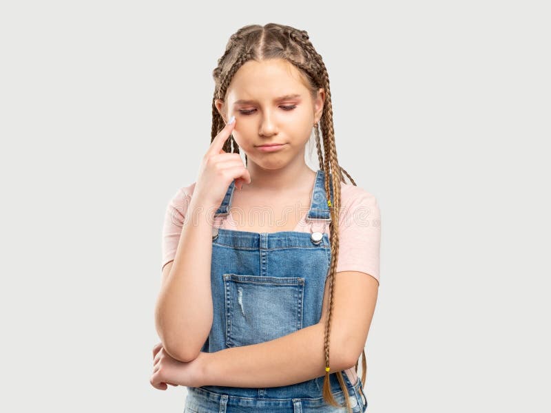 Upset girl portrait offended child looking down