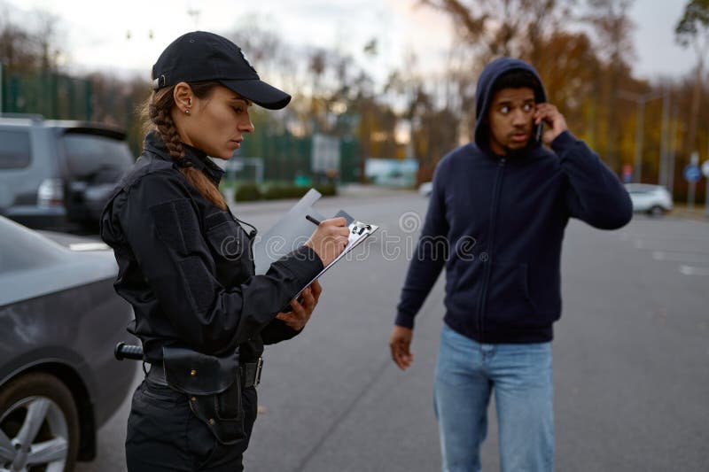 Upset man and police woman issuing fine