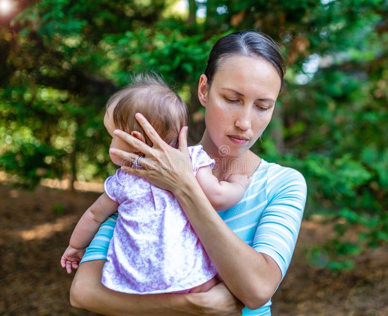 Upset Mother Protects Her Daughter stock images Upset Mother Protects Her Daughter stock images