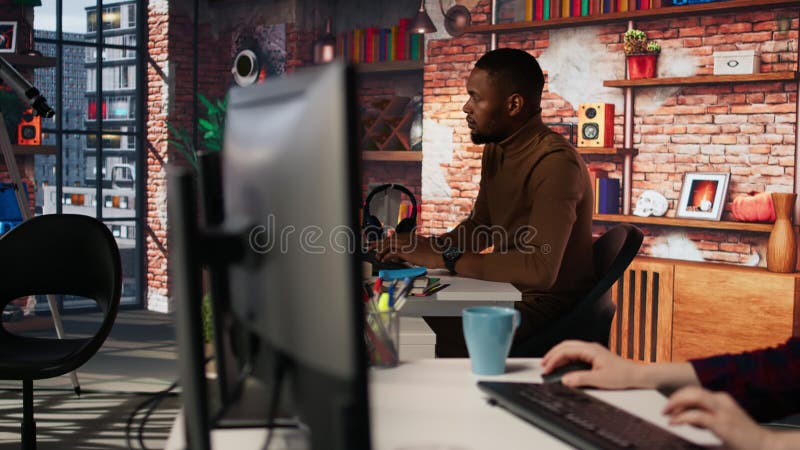 Upset programmer annoyed by computer bugs while coding in IT startup office stock footage