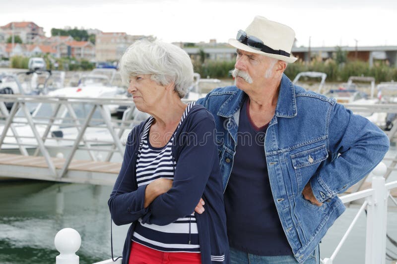 Upset senior couple outdoors stock image