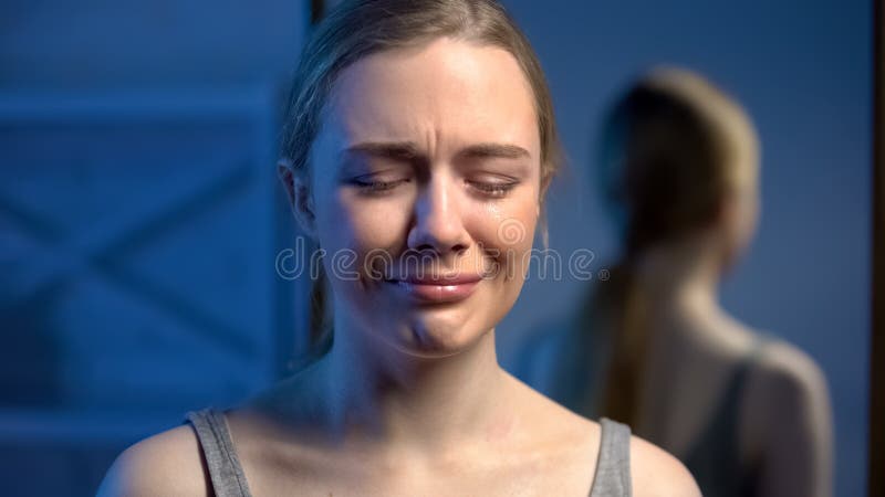 Upset young lady crying, domestic violence victim, puberty age depression, abuse royalty free stock photography Upset young lady crying, domestic violence victim, puberty age depression, abuse royalty free stock photography