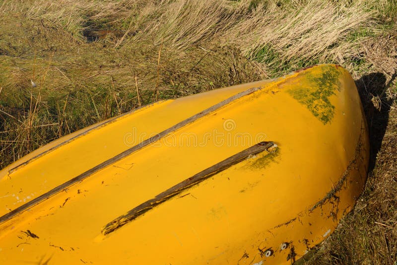 Upturned yellow row boat stock photo. Image of outdoors 37500860