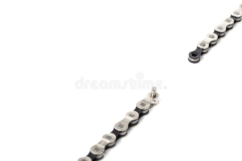 a dropped link of a bicycle chain, the weakest link, a broken chain, on a white isolated background. a dropped link of a bicycle chain, the weakest link, a broken chain, on a white isolated background