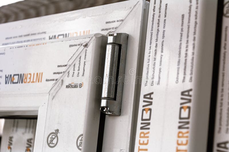 UPVC window hinges. Furniture elements of white pvc plastic window profile Internova royalty free stock image