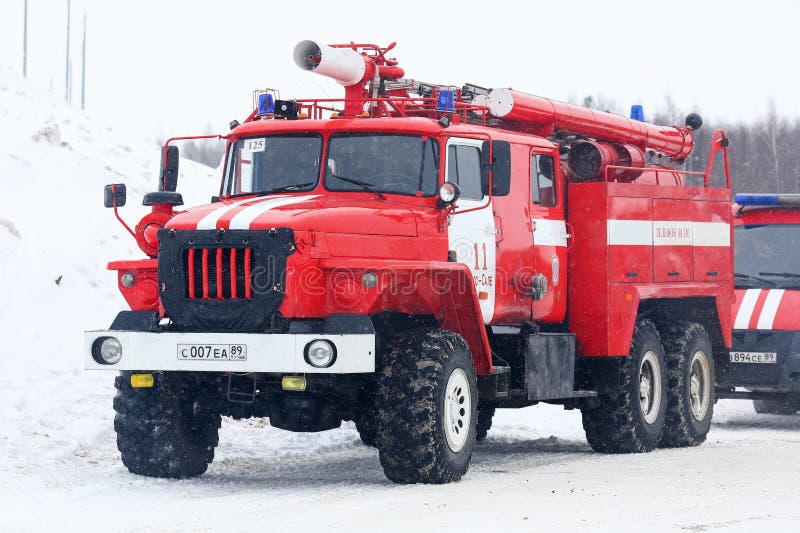 Tarko-Sale, Russia - March 2, 2024: Firetruck Ural-4320 in the city street. Tarko-Sale, Russia - March 2, 2024: Firetruck Ural-4320 in the city street