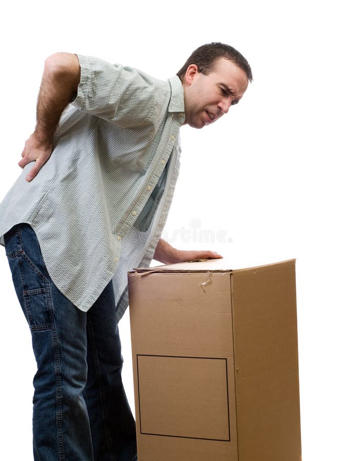 A man dressed in casual clothing, hurt his back lifting a large box, isolated against a white background. A man dressed in casual clothing, hurt his back lifting a large box, isolated against a white background