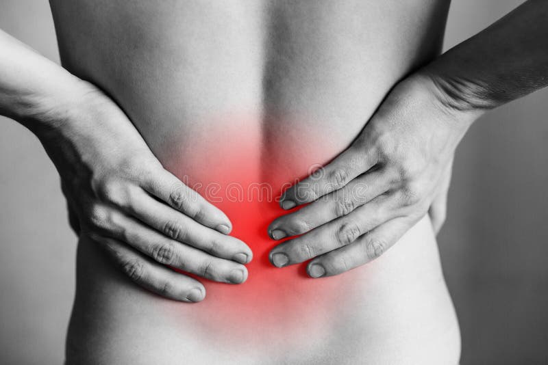 Injuries to the spine and lower back, fatigue at work. Area of the injury, the image on a clean background. Spasm on the man`s back. Injuries to the spine and lower back, fatigue at work. Area of the injury, the image on a clean background. Spasm on the man`s back