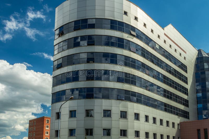Urban Architecture, Oval Shaped Building Against the Sky. Stock Image