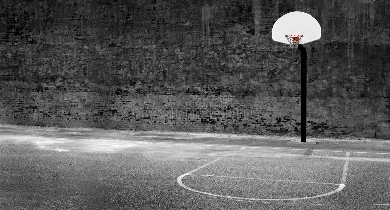 Urban basketball hoop inner city innercity wall and asphalt in outdoor park