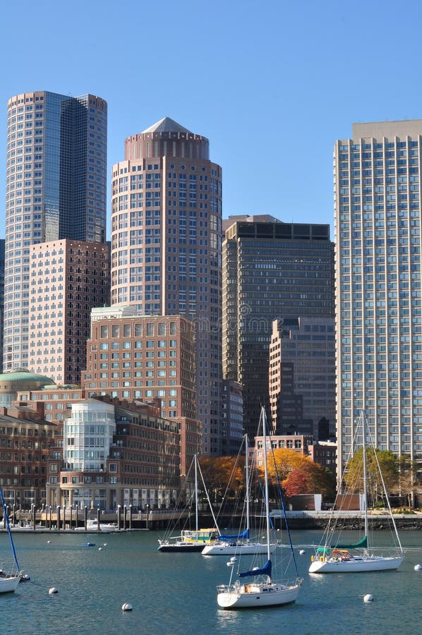 Urban buildings and sailing boats in Boston Harbor