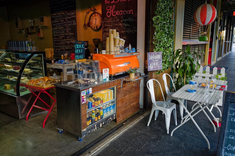 Urban Cafe Decorated for Christmas with Customer with Plastic Bag