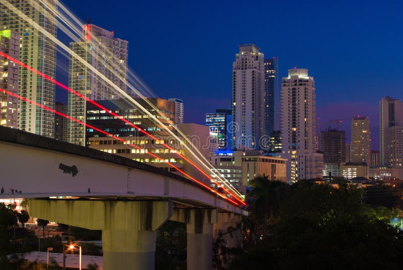 Miami Elevated Commuter Train Tracks and City Buildings at Night. Night train stock images, royalty-free photos and pictures